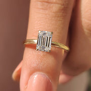 Emerald Cut Solitaire Ring In Yellow Gold With Basket Design