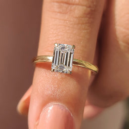 Emerald Cut Solitaire Ring In Yellow Gold With Basket Design