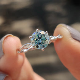 Round Solitaire Engagement Ring With Twisted Setting