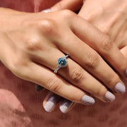 Cyan Blue Round Cut Engagement Ring With Twisted Pave